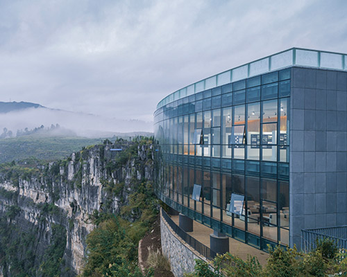 on a cliff face limestone gallery nestles into shangri-la's haiwei canyon
