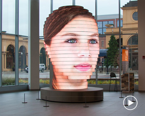 fourteen foot interactive sculpture projects your face to re-contextualize different cultures