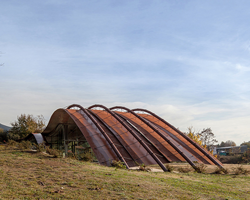 miquel subiras' organic-shaped cultural center in spain mimics its surrounding nature