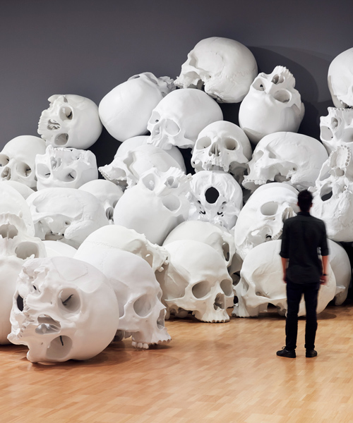 ron mueck scales-up and stacks 100 sculpted skulls at the national gallery of victoria