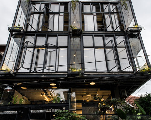 module K blends indochine and modernist elements for a mixed use building in vietnam