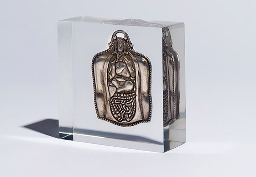 studio nucleo melds antique ex-voto souvenirs in resin