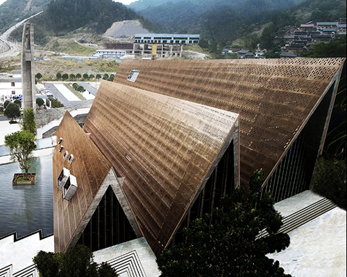 west-line studio's triangular-shaped cultural center in china pays homage to shui people