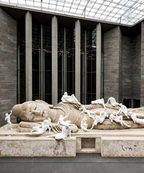 xu zhen blends east and west with buddha figure buzzing with greek and roman figures