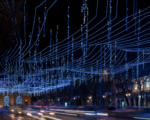 rainbow-hued light labyrinth by brut deluxe forms an immersive infinity ...