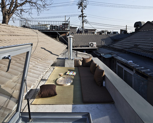chaoffice renovates a hutong house in beijing creating two boxes apartment