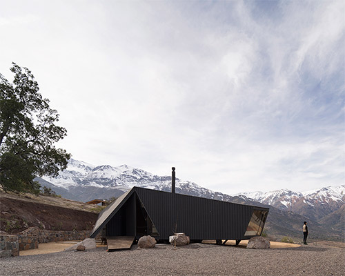 gonzalo iturriaga arquitectos folds roof into angled entrance in chile's mountaineer refuge