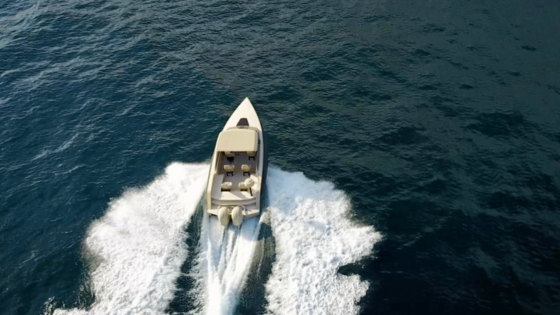 iguana s commuter amphibious yacht drives out of the sea onto the beach commuter amphibious yacht drives out