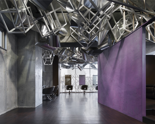 moriyuki ochiai designs tokyo beauty salon with entwined metal layers
