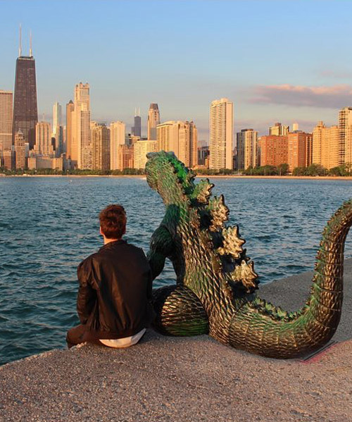 the artist who never travels without his dinosaur