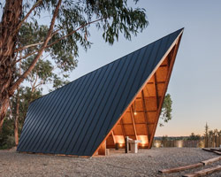 plano humano arquitectos sites discreet, tent-shaped chapel in portugal