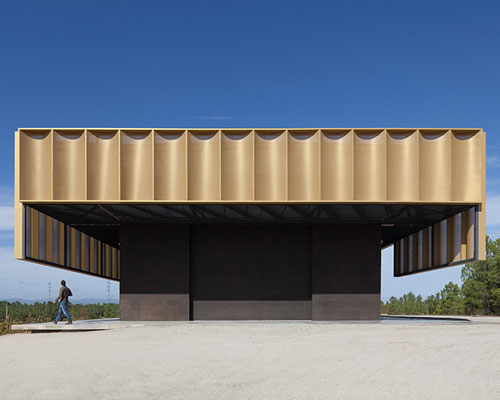 atelier rua wraps a winery pavilion in golden colored metal skin in portugal