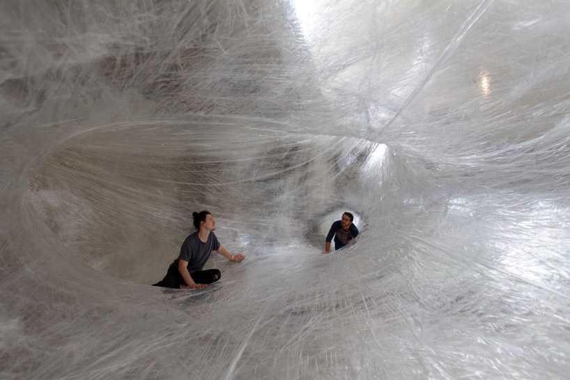 numen/for use create massive parasitic-like tape sculpture for you to explore