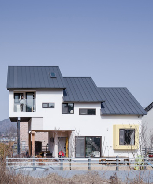 KDDH designs a house within a small lot in korea using a skip floor plan layout