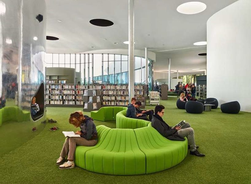 dominique coulon's flowing-shaped media library in france houses two cultural programs