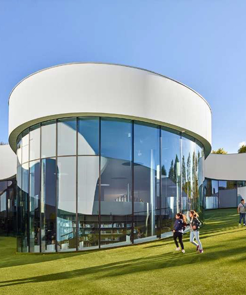 dominique coulon's flowing-shaped media library in france houses two cultural programs