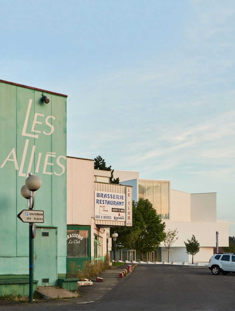 dominique coulon's white volume-stacked theater in france becomes a symbol of the city