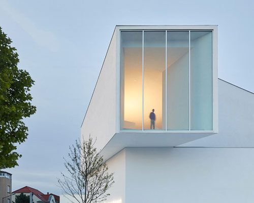 dominique coulon's white volume-stacked theater in france becomes a symbol of the city
