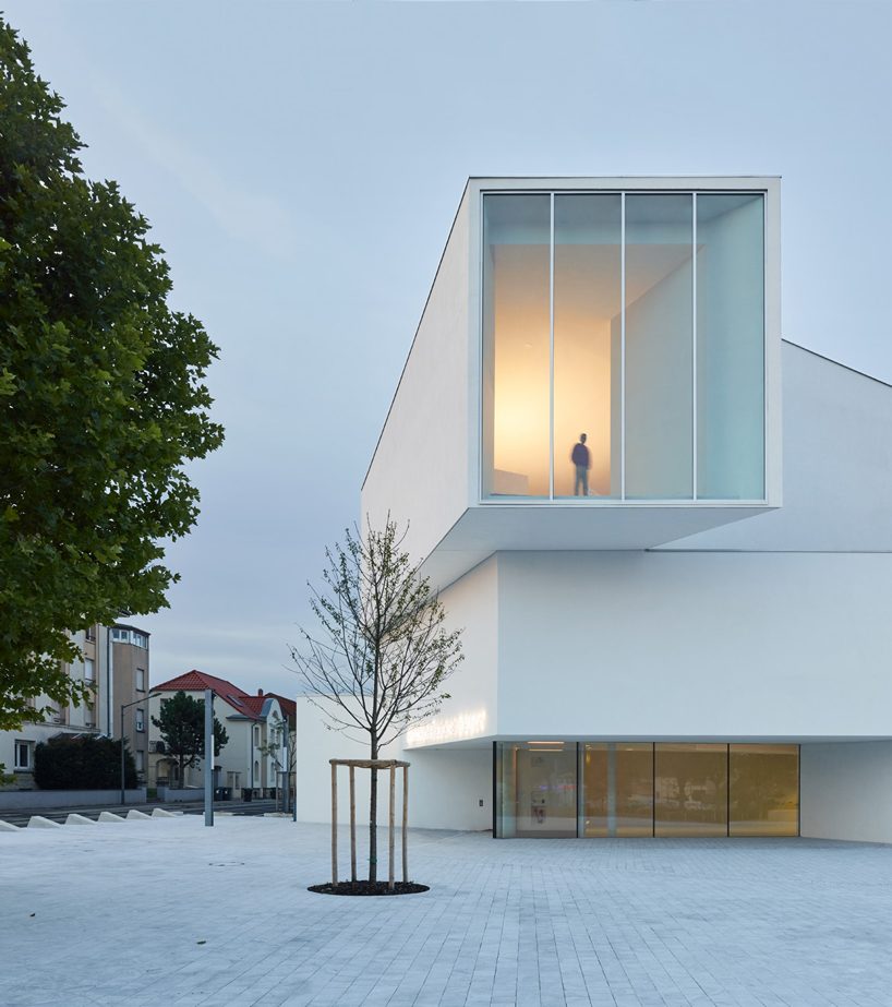 dominique coulon's white volume-stacked theater in france becomes a symbol of the city