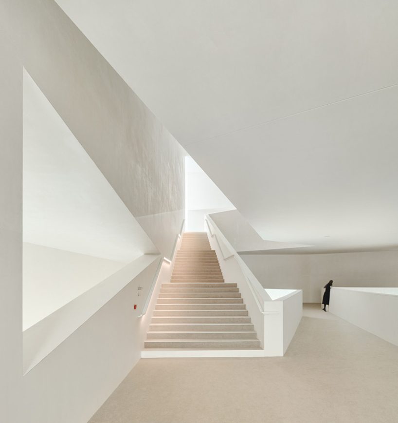 dominique coulon's white volume-stacked theater in france becomes a symbol of the city