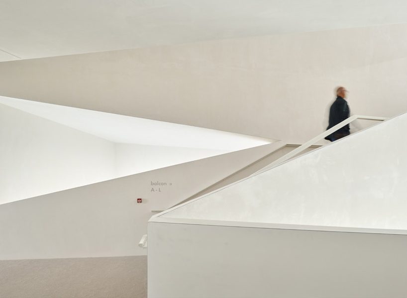 dominique coulon's white volume-stacked theater in france becomes a symbol of the city