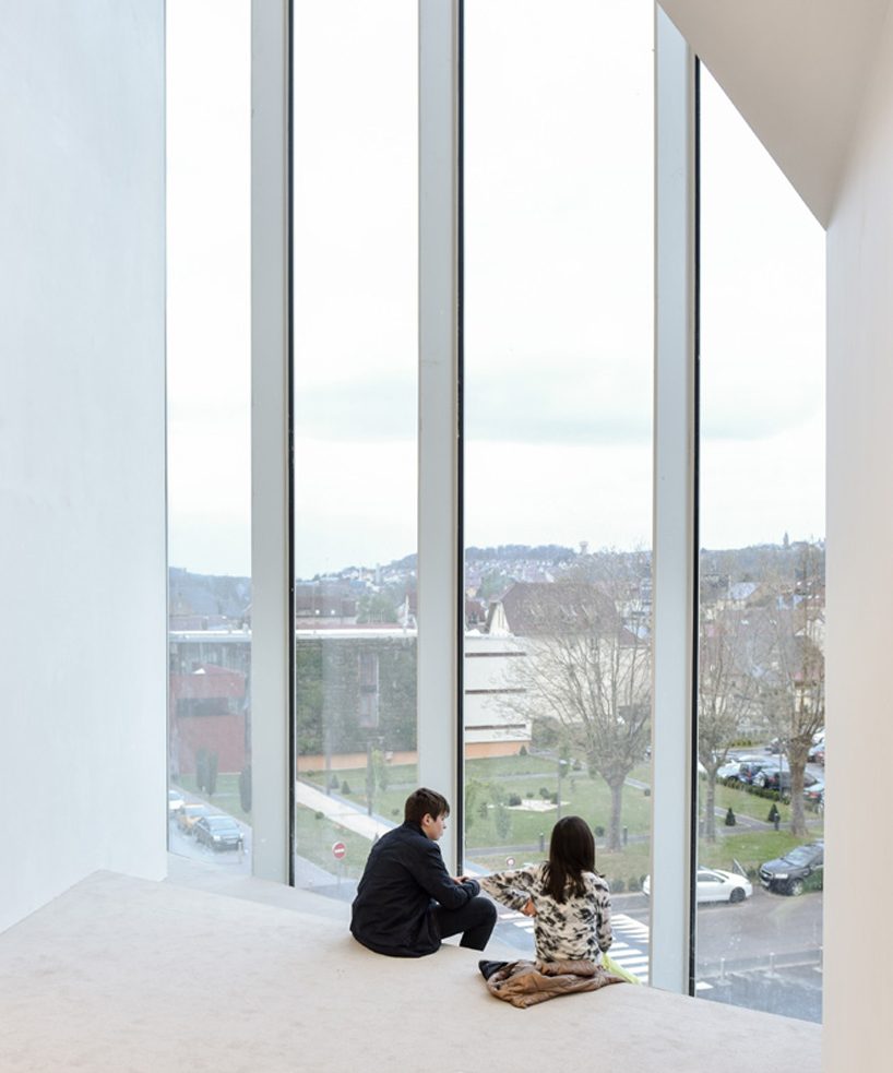 dominique coulon's white volume-stacked theater in france becomes a symbol of the city