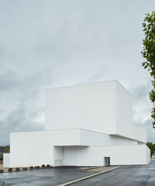 dominique coulon's white volume-stacked theater in france becomes a symbol of the city
