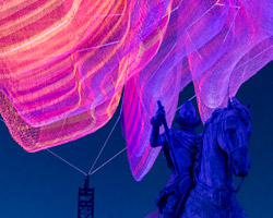 janet echelman hovers seemingly-weightless net sculpture above a madrid plaza