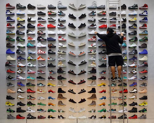 flight club store in LA is devoid of anything except product display and a bench, by slade architecture