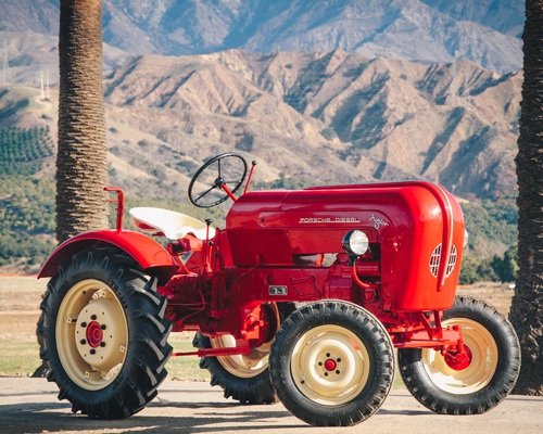 this 1956 cherry red porsche tractor is up for auction, y'all
