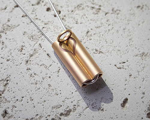 dario narvaez’s minimal necklace plays with light to reveal a hidden message