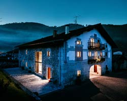 BAT redesigns a 300-year-old farmhouse into a modern home with a two-level window