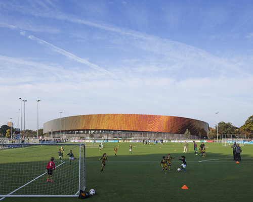 faulknerbrowns' copper-enveloped sports campus in the hague embodies principle of motion
