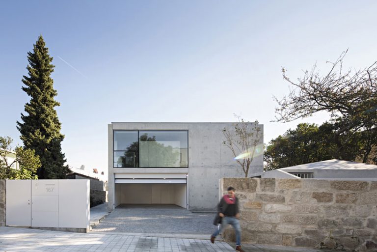 this sleek concrete home by joão vieira de campos doesn't have a door