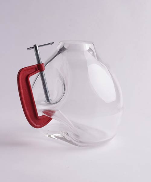 joão xará pinches glass vessels to represent the action of force
