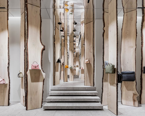 kengo kuma creates enchanted forest pop-up inside valextra's milan store