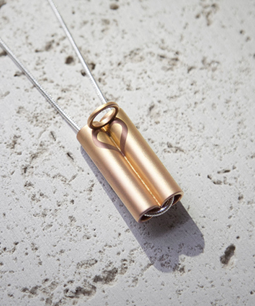 dario narvaez’s minimal necklace plays with light to reveal a hidden message