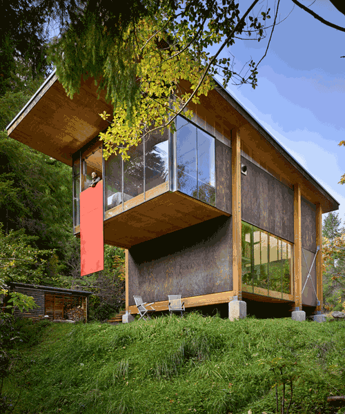 this sustainable forest studio was scavenged together using discarded house parts