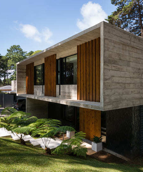 paz arquitectura's exposed concrete house in guatemala contrasts with surrounding woods