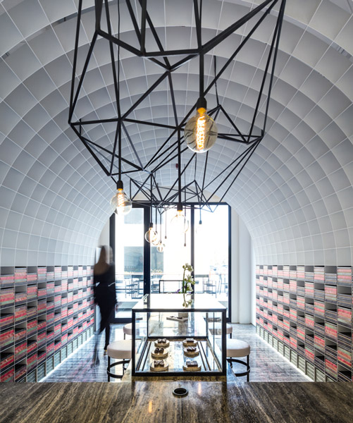 studio toggle encloses chocolate boutique within a cellular steel vault