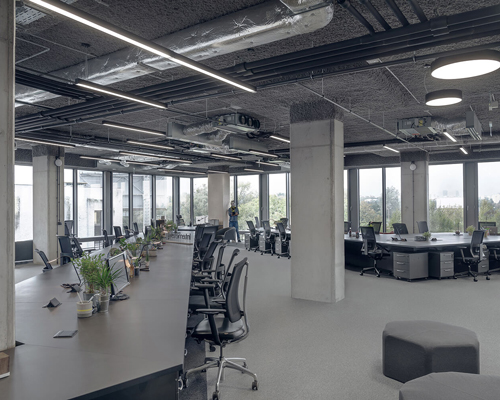 KOS architects' latest design is a spatially opened and flexible workstation in poland