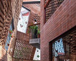 this vietnamese townhouse is an urban brick cave that simulates nature