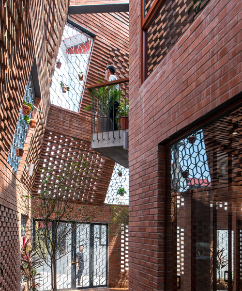 this vietnamese townhouse is an urban brick cave that simulates nature