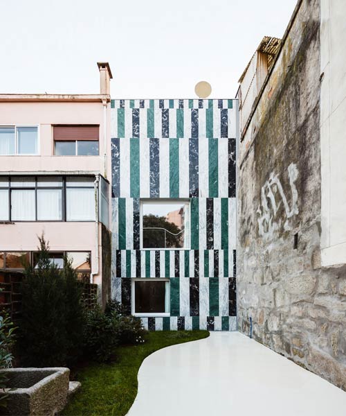 fala atelier completes the house in rua do paraíso covered with marble stripes