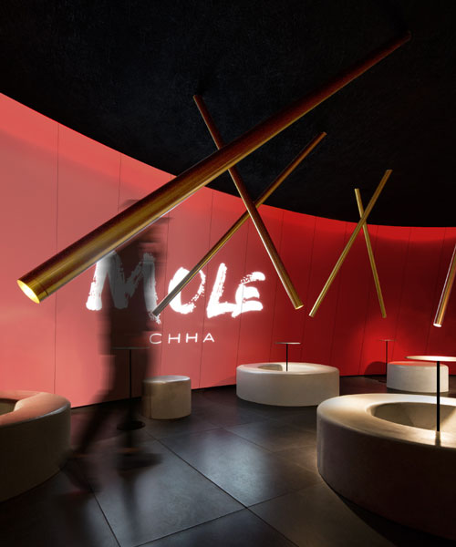 infinity nide's mole chha is a dome teahouse with red gradient walls and brass lighting tubes