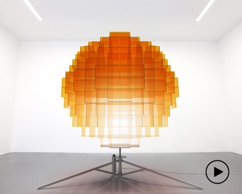 vincent leroy's sunrise installation rotates to display a globe of blurry light