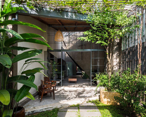 23o5 studio merges interior and exterior spaces in this vietnamese house