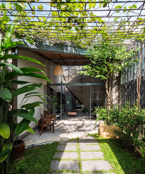 23o5 studio merges interior and exterior spaces in this vietnamese house