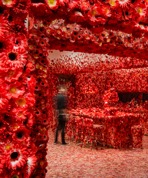 yayoi kusama obliterates a room with a virus of beautiful red flowers