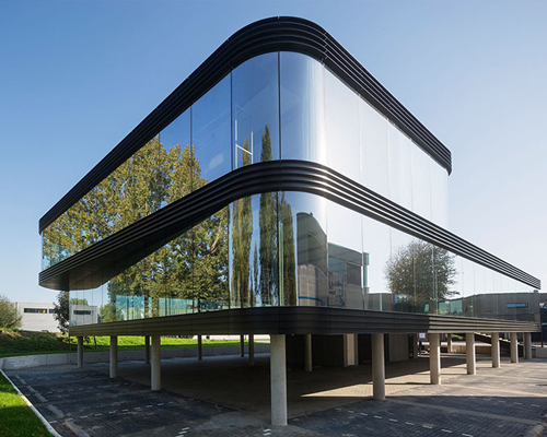 EVA architecture designs flowing glass-covered sustainable building in the netherlands